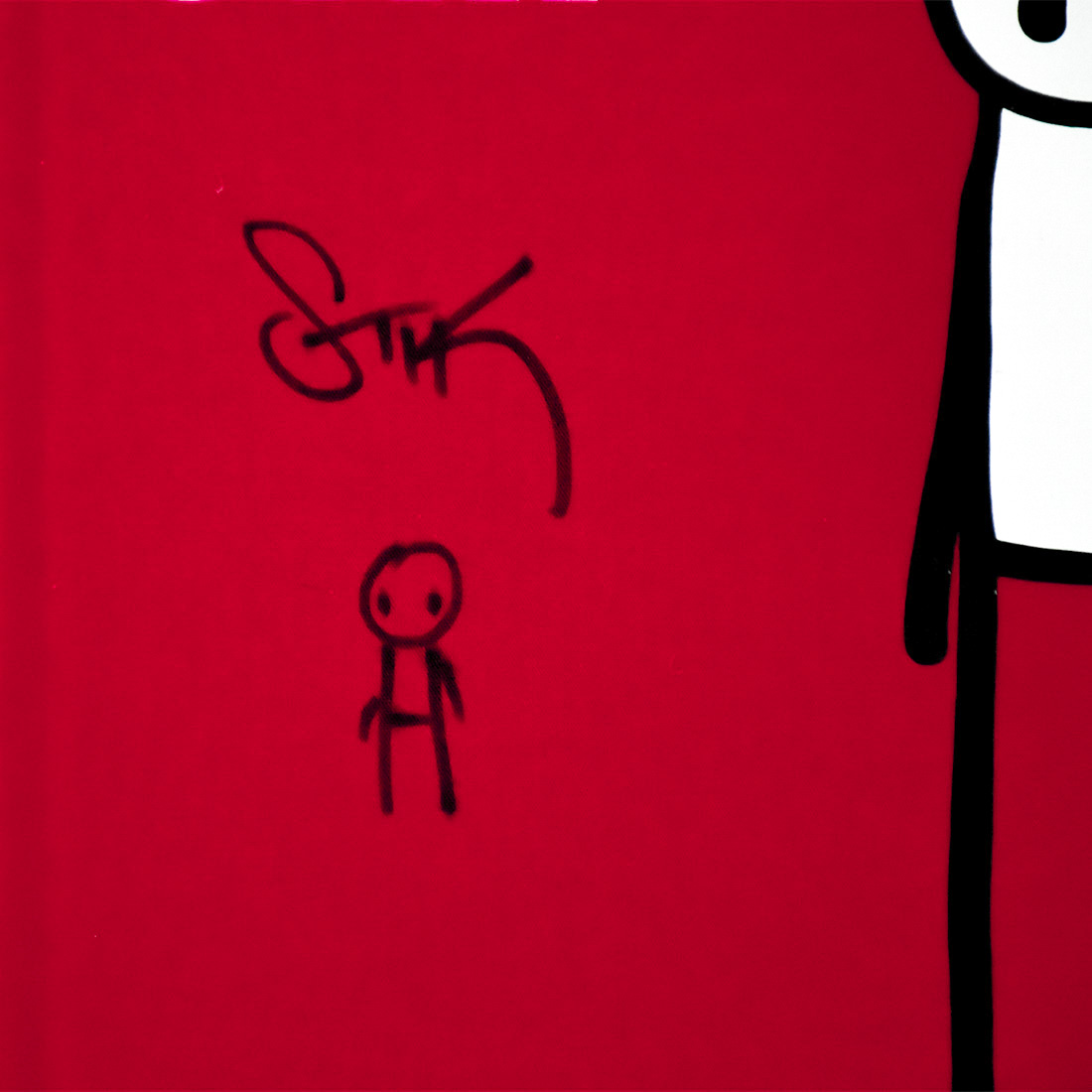 close up of artist stik book signed with hand drawn figure on cover