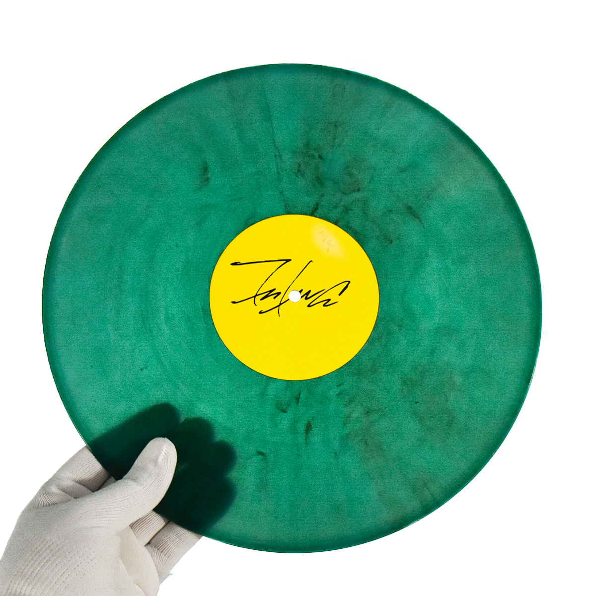 person holding the escapades of futura 2000 green record side a