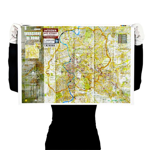 person holding invader roma signed map print