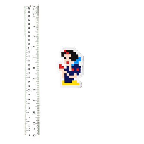 invader snow white sticker next to ruler for scale