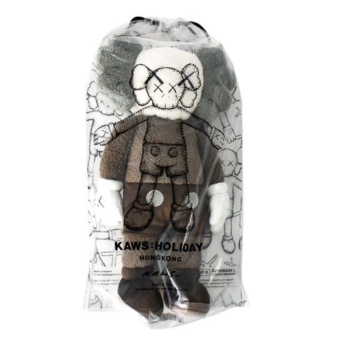 kaws holiday hong kong brown plush in package from front
