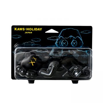 kaws holiday japan vinyl figure in black in sealed package