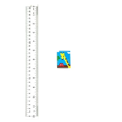 invader giraffe sticker next to ruler for size scale