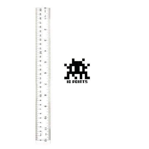 invader 10 points sticker next to ruler for scale