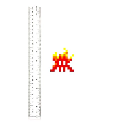 invader fire sticker next to ruler for scale