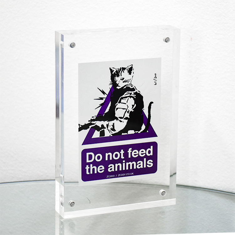zedsy do not feed the animas sticker framed in clear block frame