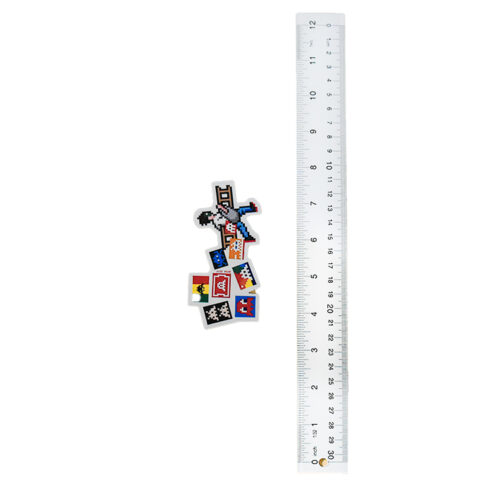 invader with ladder sticker shown next to ruler for scale