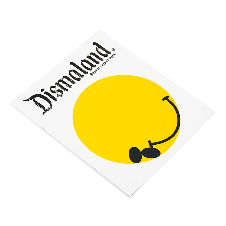 banksy dismaland official program book shown from side