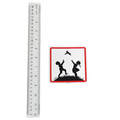 banksy kids with guns sticker next to ruler