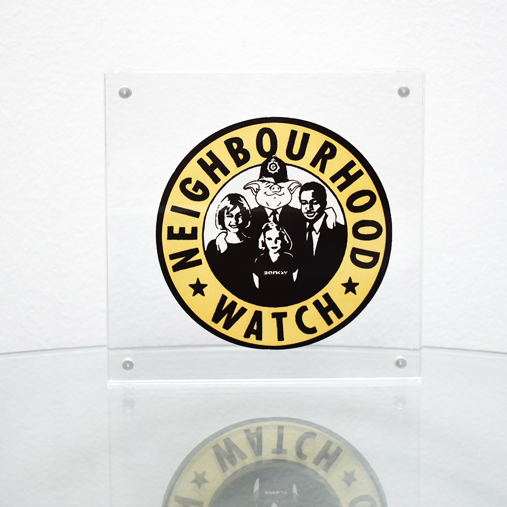 banksy neighbourhood watch sticker in clear frame
