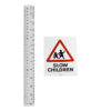 banksy slow children sticker next to ruler