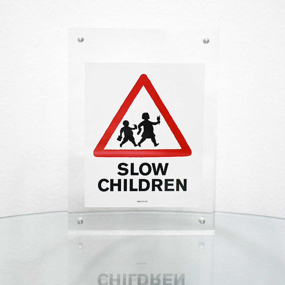 banksy slow children sticker in clear frame