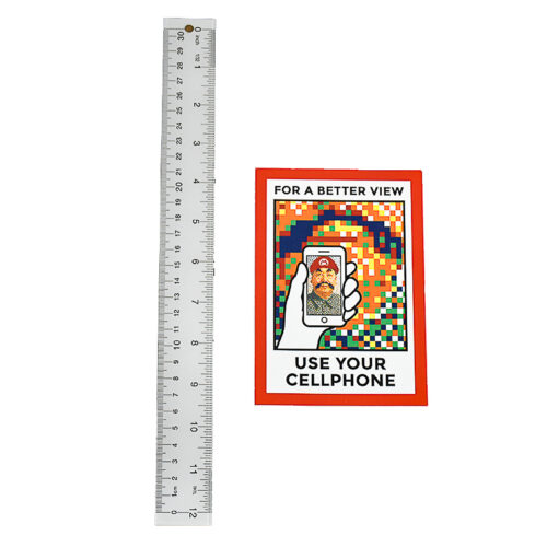 invader rubikcubism postcard sticker next to ruler for scale