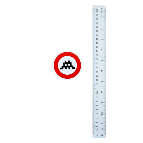 invader circle sticker large next to ruler