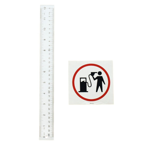 banksy petrol head sticker next to ruler for scale