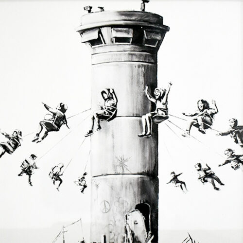 close up of print from banksy walled off hotel box set