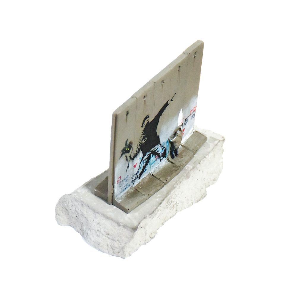 banksy walled off hotel flower thrower wall sculpture from side