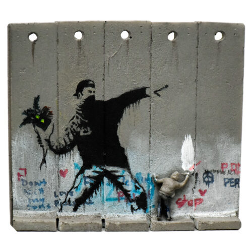 close up of banksy walled off hotel flower thrower wall sculpture