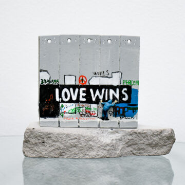banksy walled off hotel love wins wall sculpture