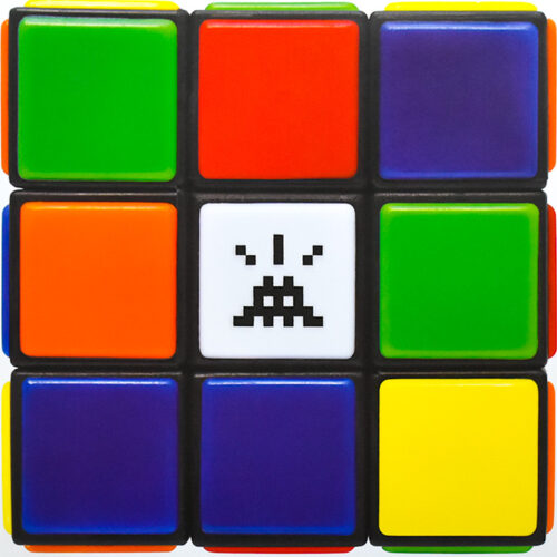 close up of middle of invader rubikcubist mima exhibition poster of rubik cube with invader in center