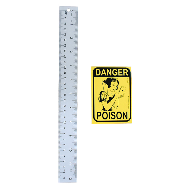 zedsy danger poison sticker next to ruler for scale