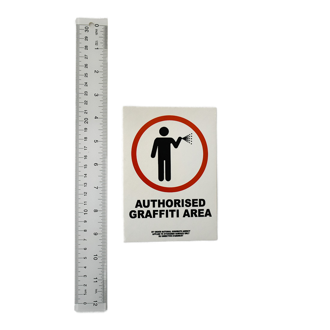 banksy authorised graffiti area sticker 016/bnk/5y next to ruler