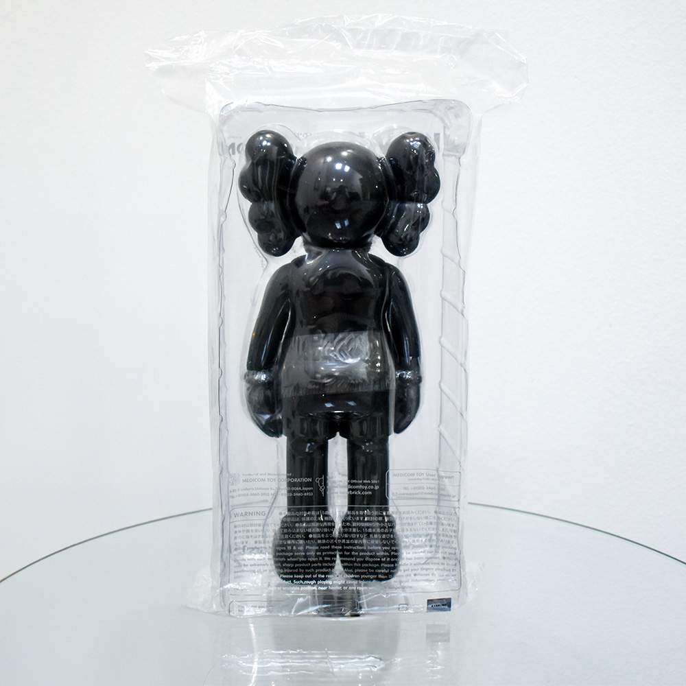 back of kaws companion black in package