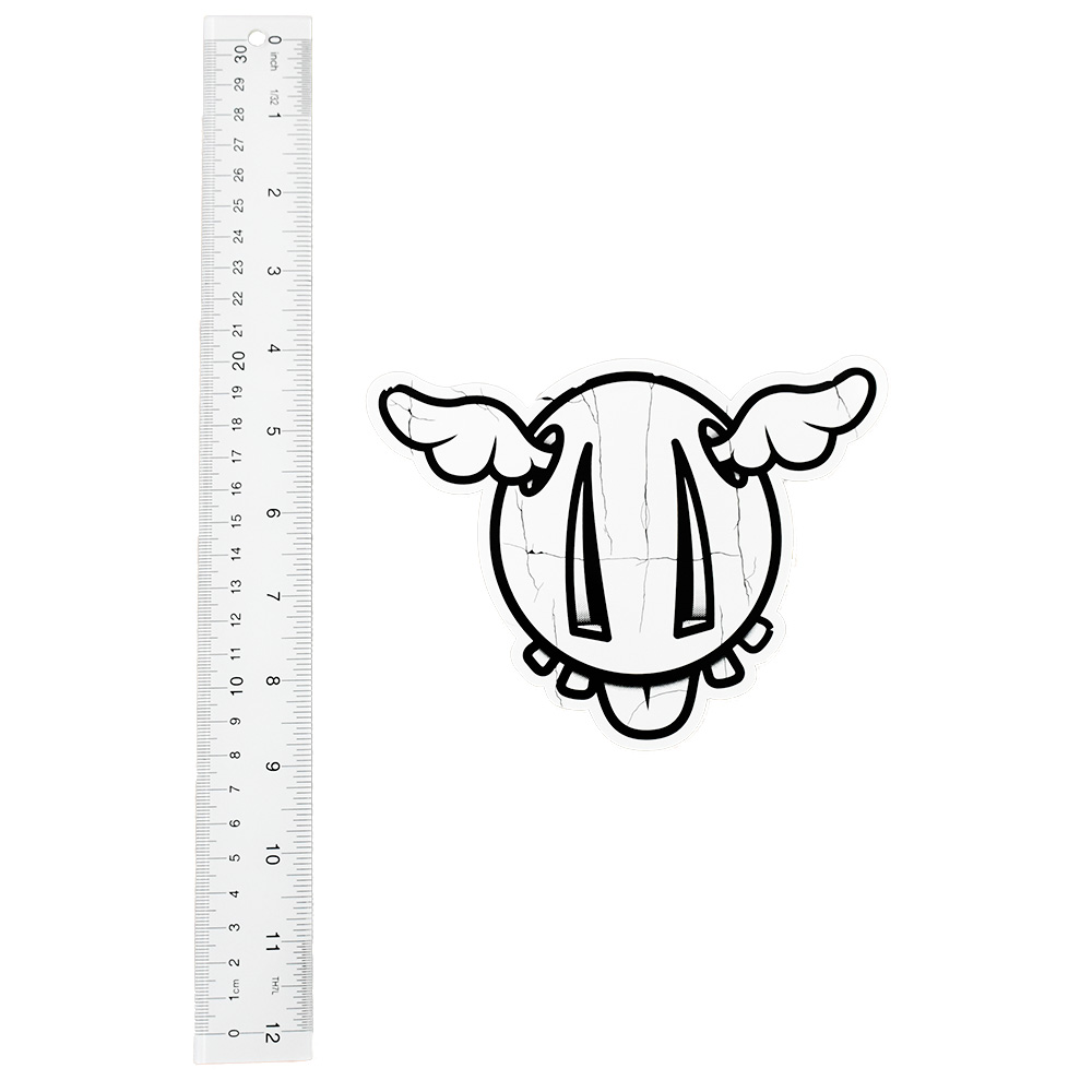 dface crackled ddog sticker next to ruler