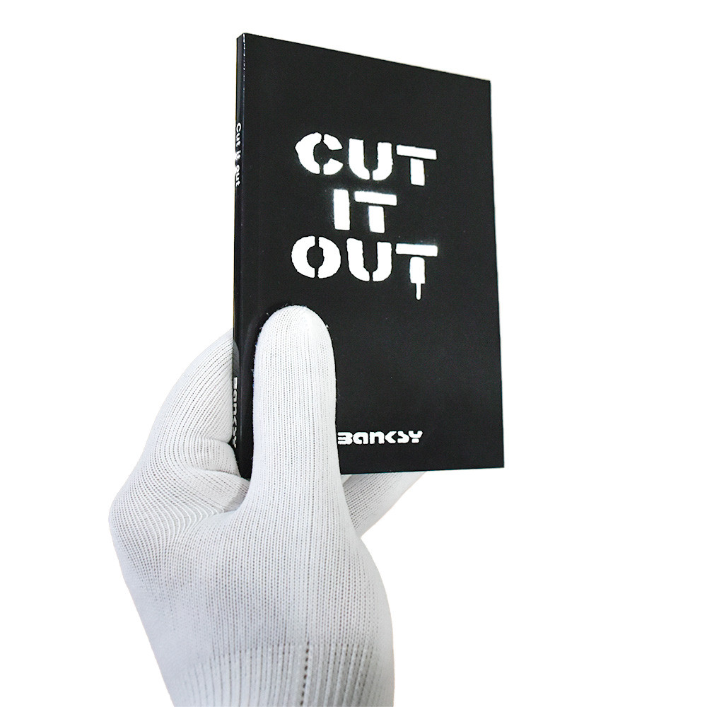 holding banksy cut it out mini book