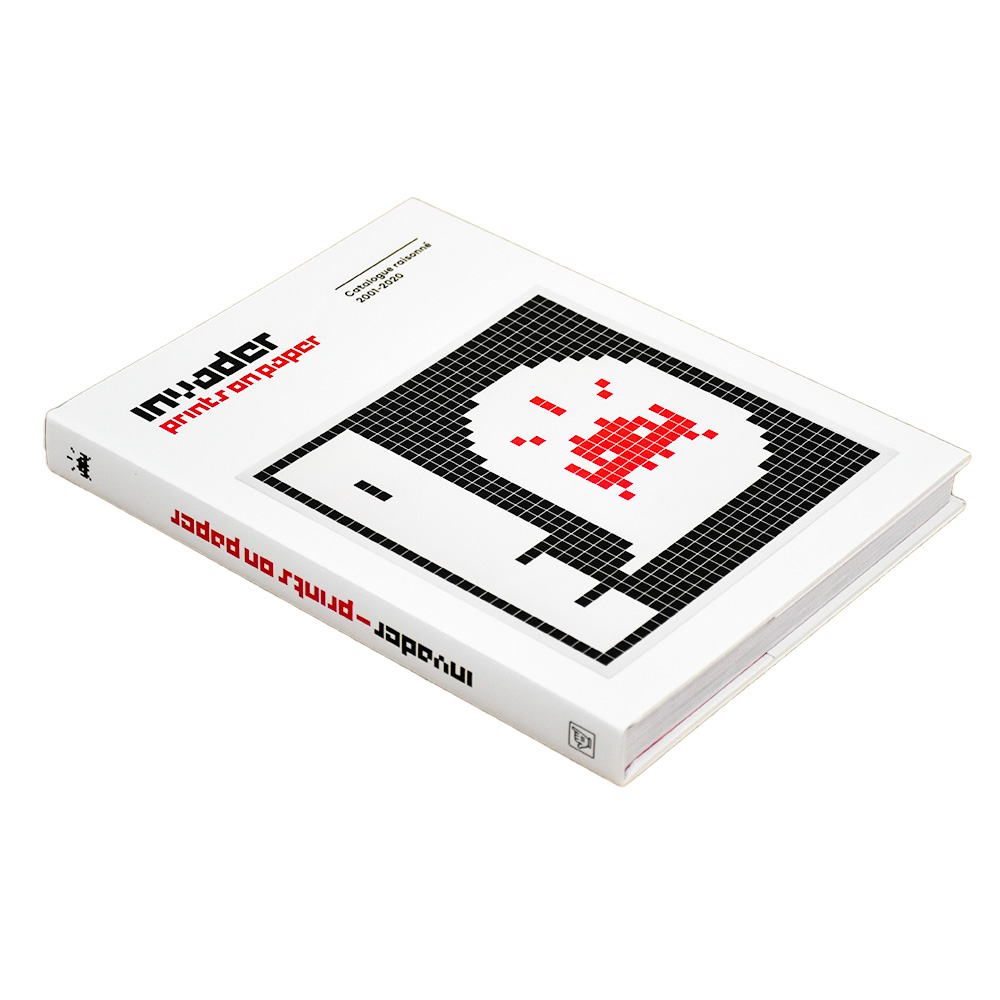 back of invader prints on paper catalog raisonne book from side view