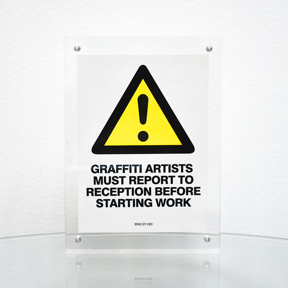 banksy graffiti artists must report to reception sticker framed