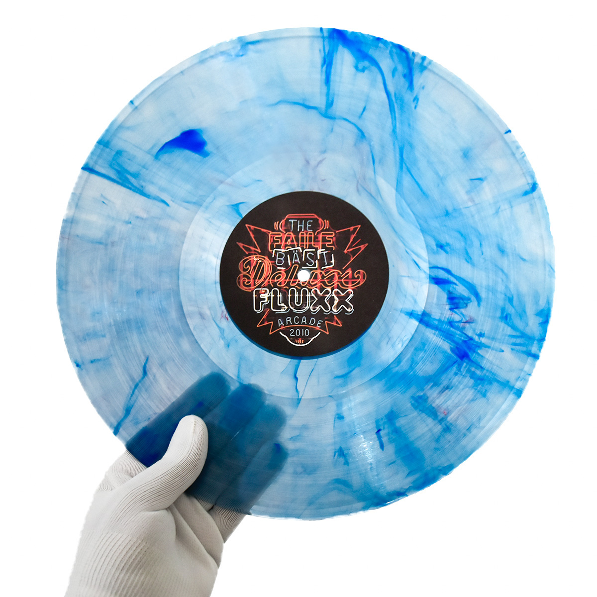 person holding faile bast deluxx fluxx unique vinyl record