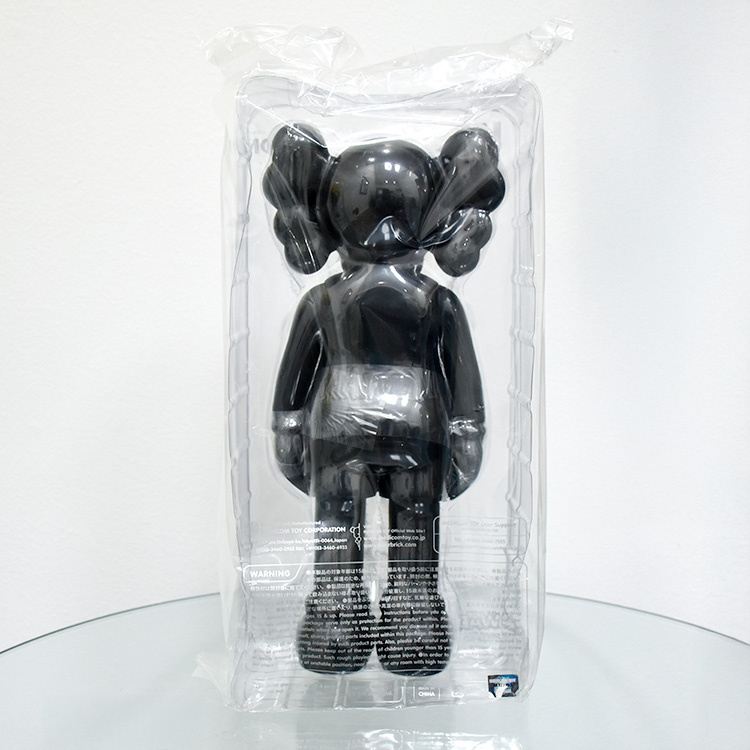 back of kaws companion figure in black from 2016